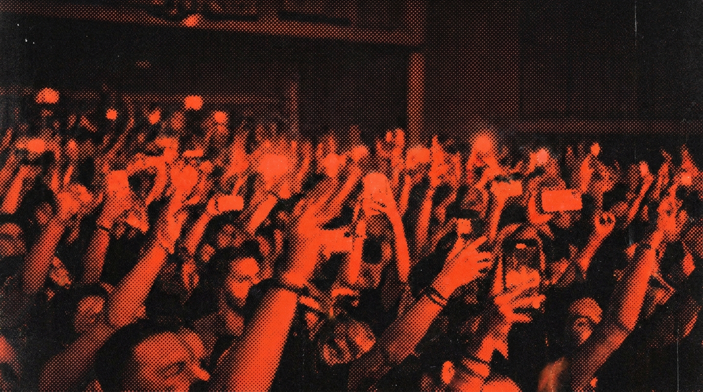 A concert crowd seen from the stage, duotone print